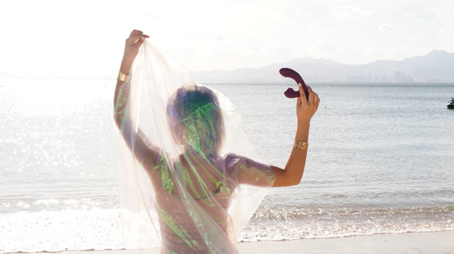 Discreetly holding a sex toy on a beach, for travel packing advice