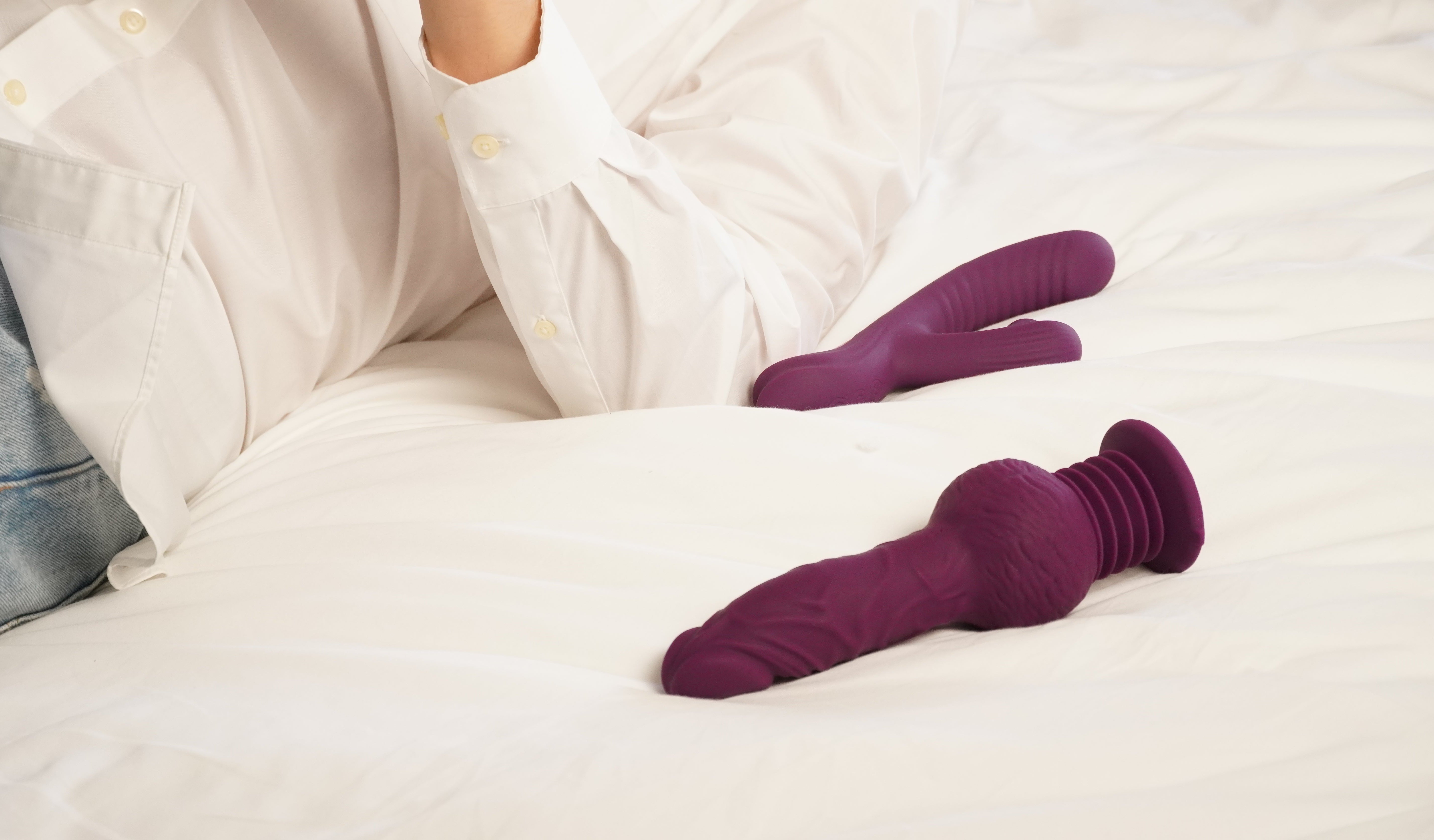 purple rabbit vibrator placed on white bed