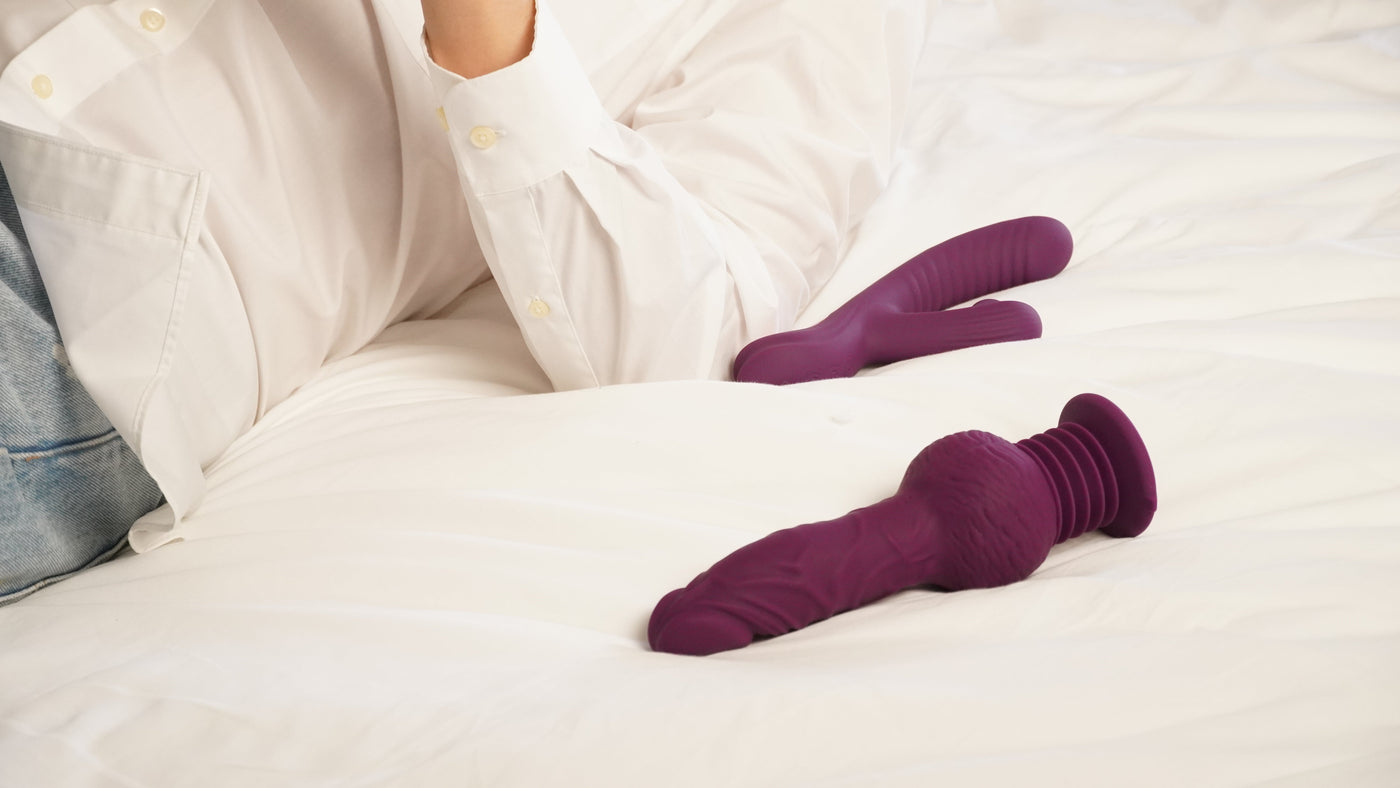 purple rabbit vibrator placed on white bed