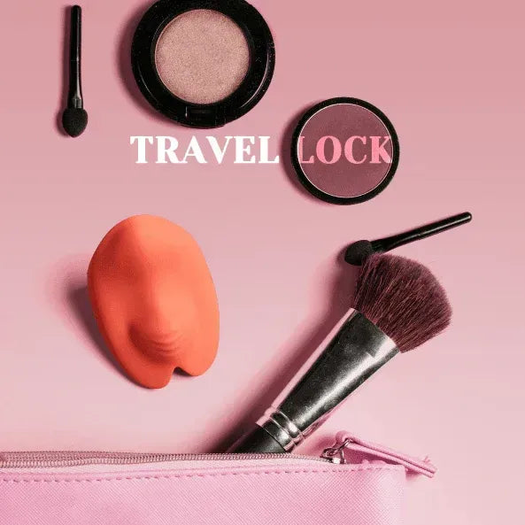 Orange wearable mini vibrator with travel lock feature on pink background