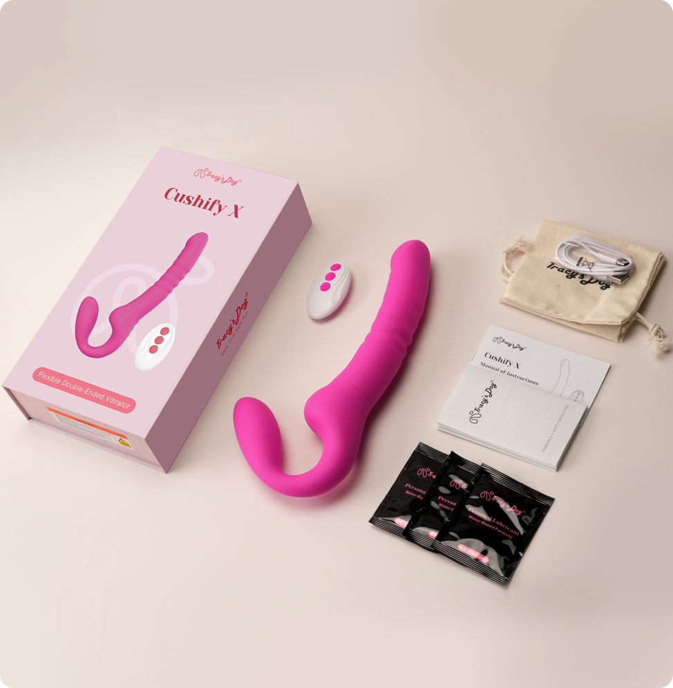 Pink Cushify X G-spot thrusting vibrator with remote, box, manual, pouch, and charging cable