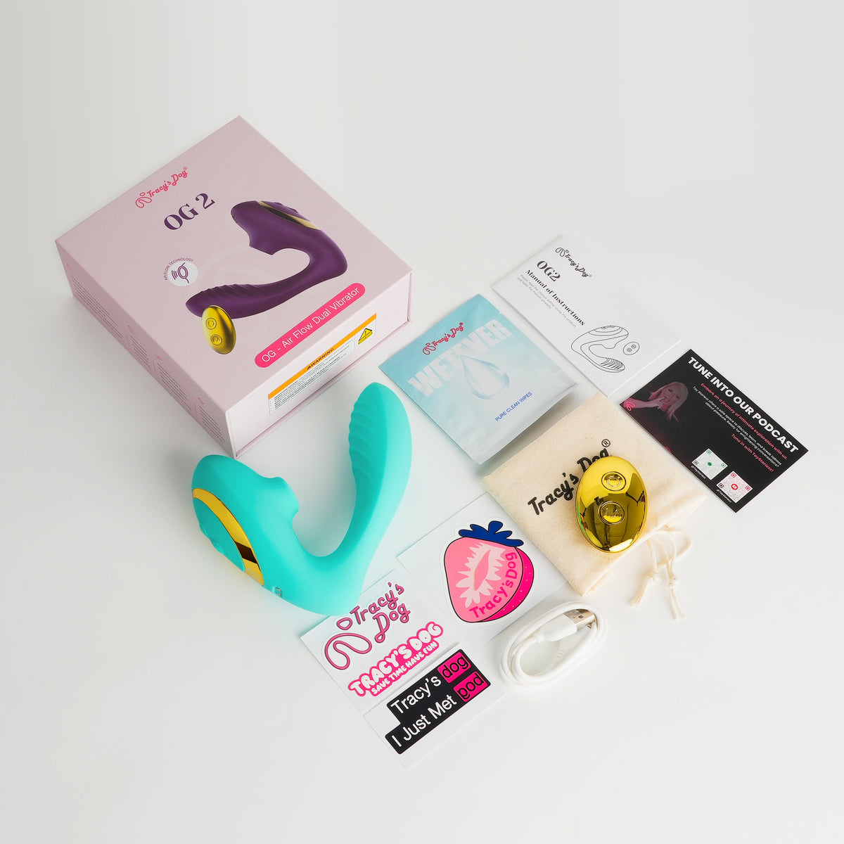 Tracy's Dog OG 2 sucking vibrator set with teal and gold device, box, pouch, manual and accessories