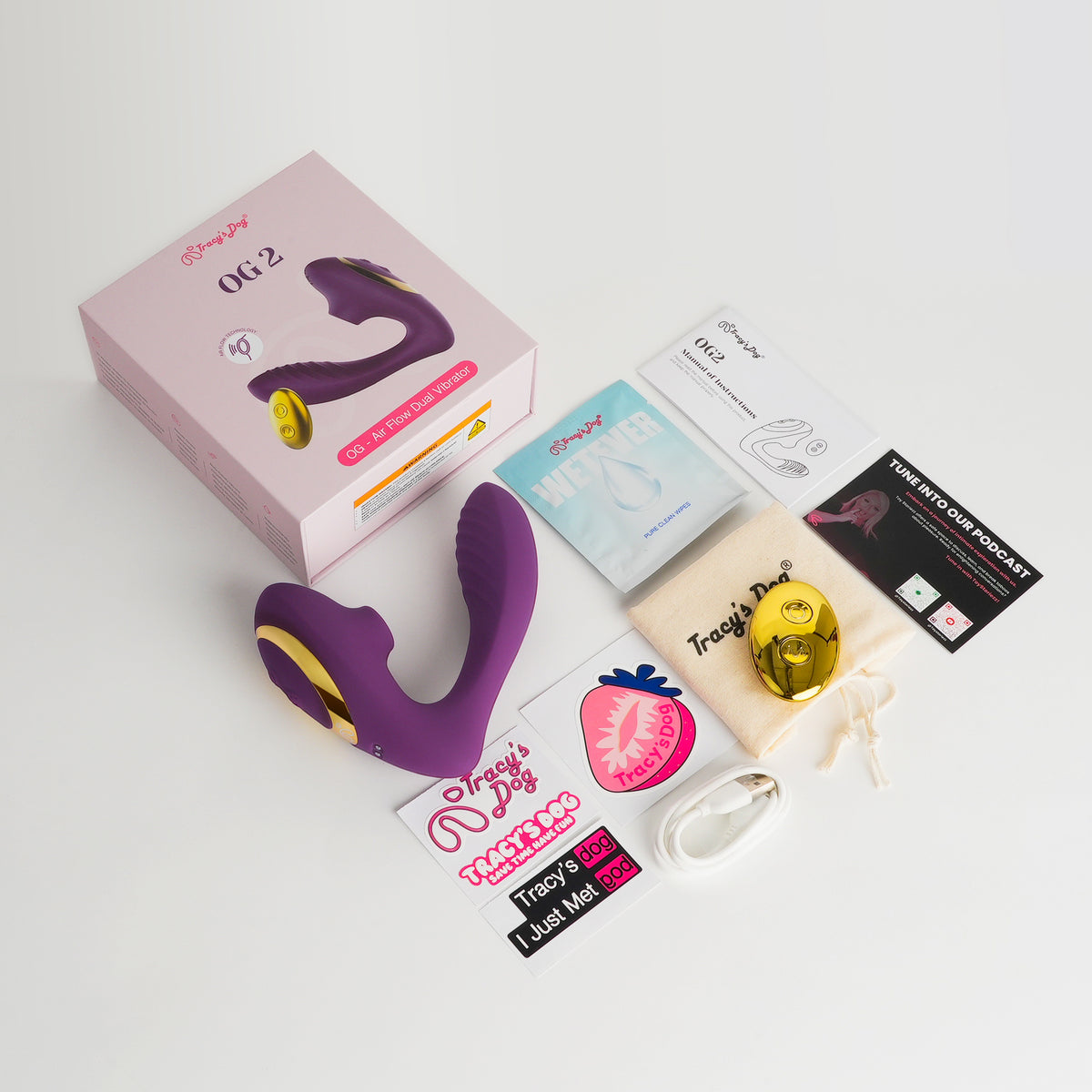 OG 2 air flow dual vibrator in purple and gold with box, charger, pouch, wipes, manual, and stickers