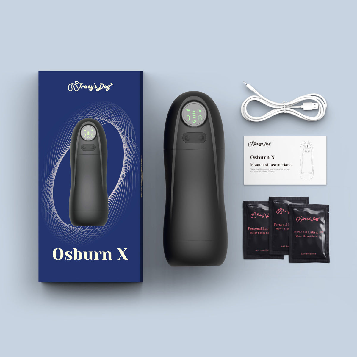 Black Osburn X automatic masturbation cup kit with USB cable, manual, and lubricant packets