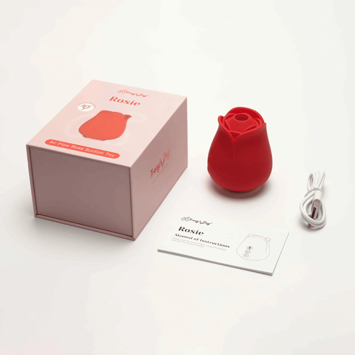 Rosie portable rose clitoral sucker with pink box, USB cable, and instruction manual