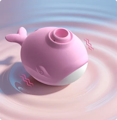 Pink whale-shaped clitoral sucker with smooth silicone body and USB charging port