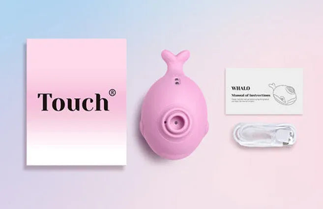Pink whale-shaped clitoral sucker with USB charger, manual, and Touch packaging